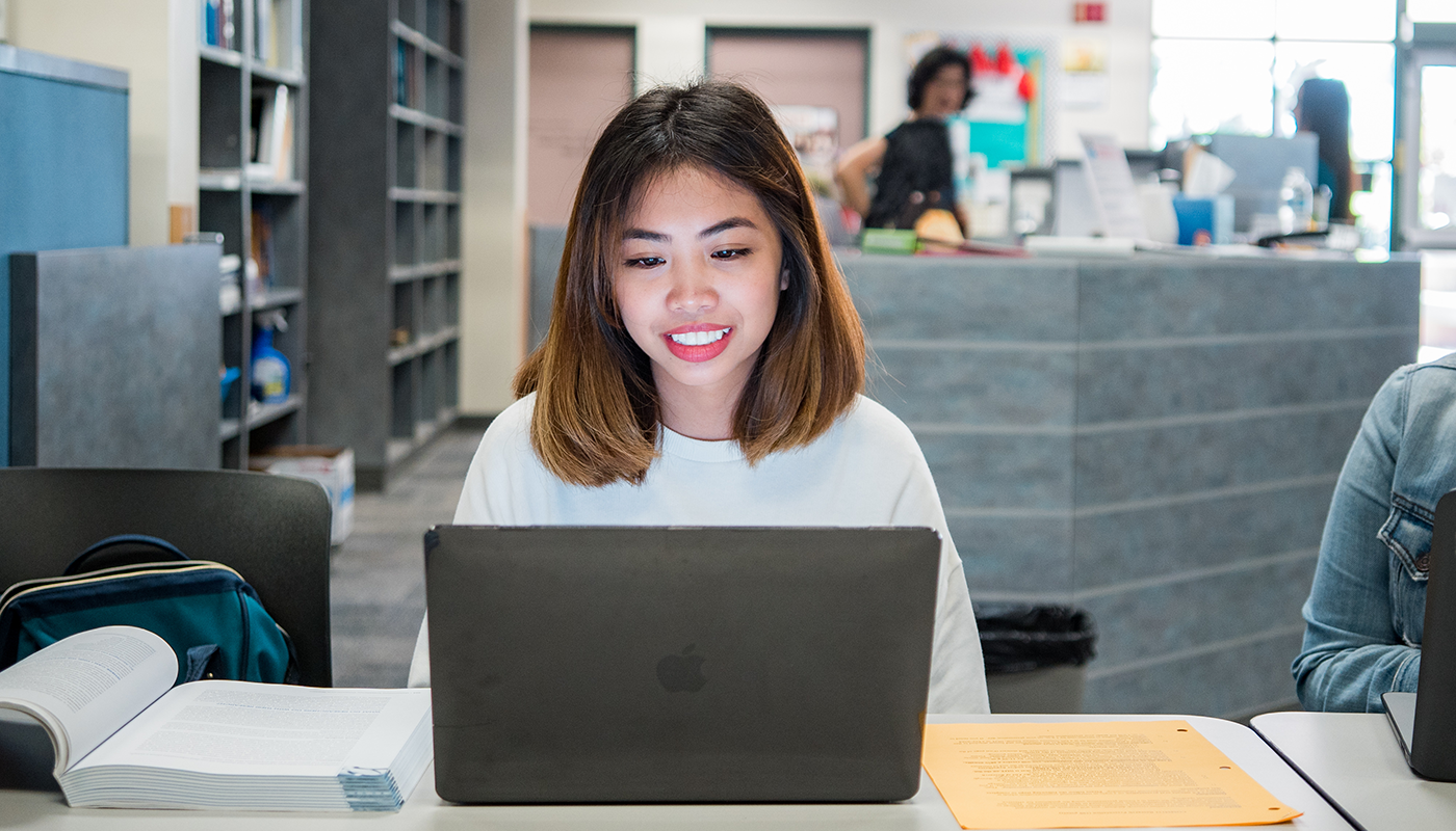 SBCC student studying on a computer.